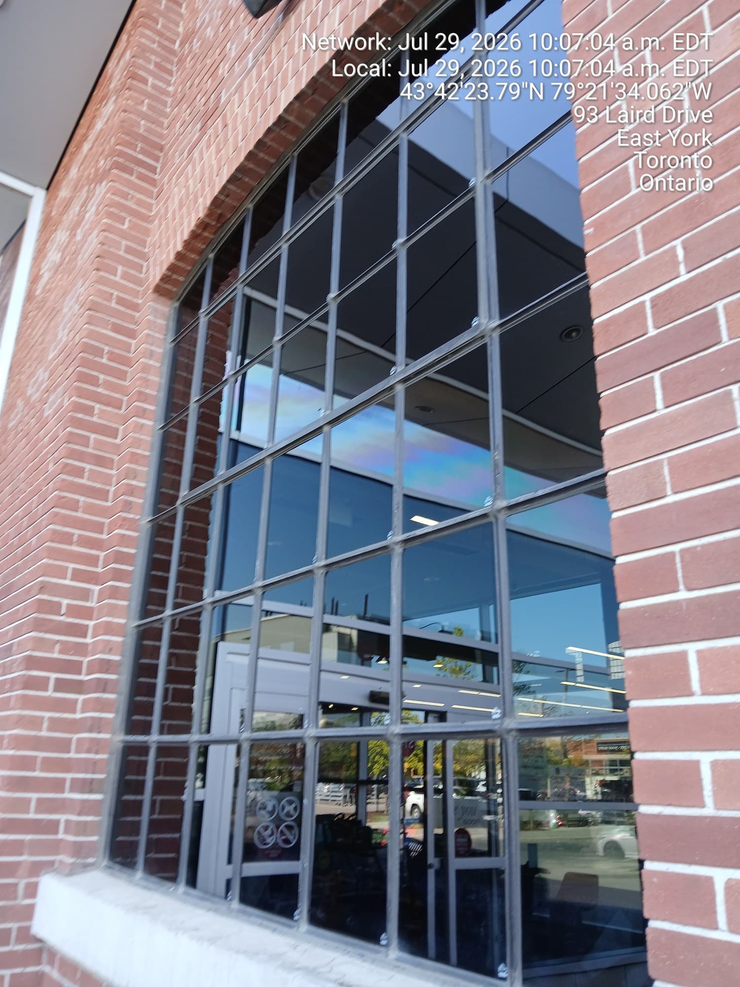 Brick and glass storefront with spotless windows